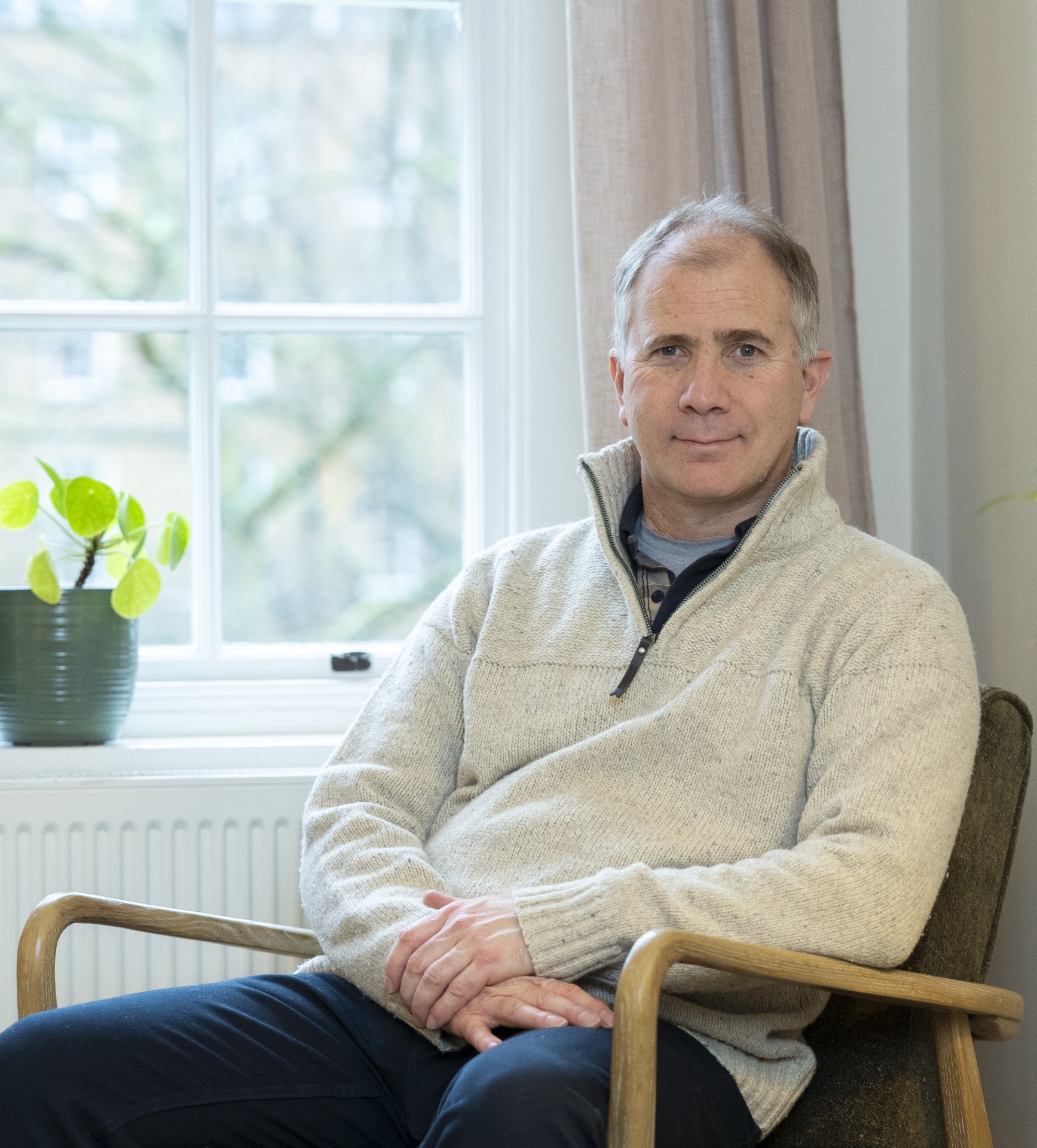 Nick Page, psychotherapist, sitting in a therapy room during a session